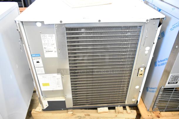 Brand new 2024 Scotsman MC1030MA-32A ice machine, 1077 lb capacity, Prodigy Elite Series, visible labels, minor scratch and dent.