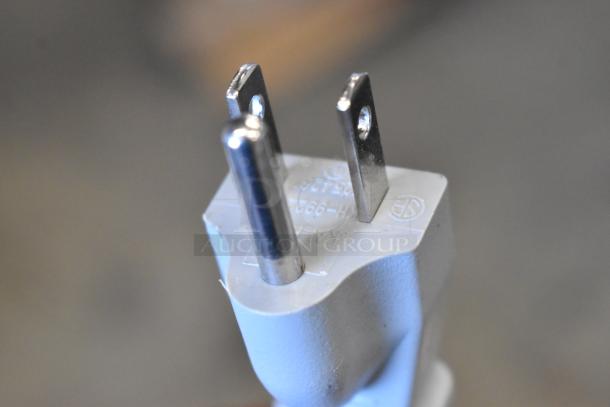 USA plug of Amana RCS10TS microwave, showing prongs and markings. Model indicates 120 volts, 1 phase.