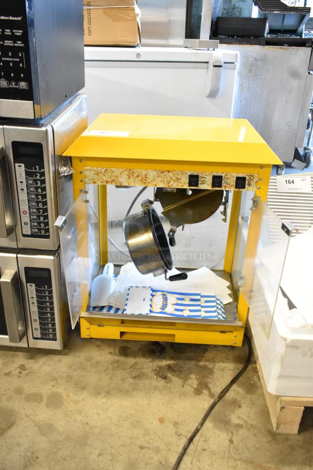 2019 OY-828 metal countertop popcorn machine, yellow finish, 110V, 1 Phase, with switches and clear panels, in used condition.