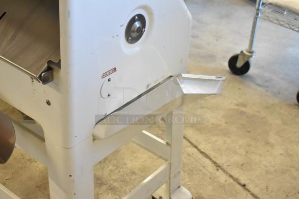 Oliver 797-32NC metal bread loaf slicer with casters, 115 volts, 1 phase. Visible wear includes minor scuffs.
