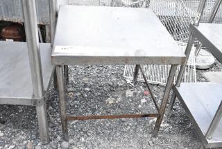 Stainless steel equipment stand with visible rust and wear, no branding, sturdy design, suitable for industrial use.