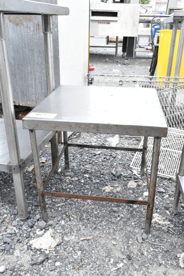 Stainless Steel Equipment Stand, square top, sturdy frame, visible rust on legs, tag number "167."