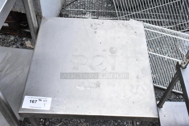Stainless steel equipment stand with a slightly worn surface, showing a 167 auction tag from PCI Auctions. Suitable for industrial use.