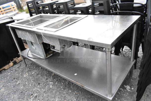 Stainless steel 2-well food warmer station with under shelf. Features include dual heating wells and sturdy construction.