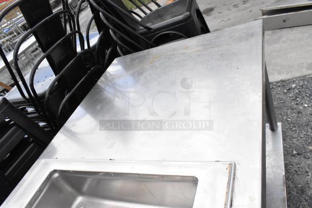 Stainless steel 2 well food warmer station with under shelf, features a sleek design and durable surface. Good condition.