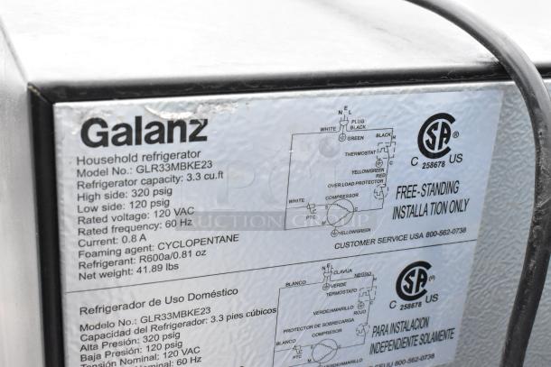 6 mini coolers including Galanz GLR3MBKE23, label showing model and specs: 3.3 cu ft, 120 VAC, R600a refrigerant.