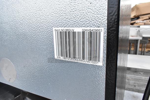 Close-up of mini cooler with visible barcode and serial number, labeled "Batch NO. B8GUV 32KHS409663. S/N: 1B0121Z0043JB8GUVE10201."