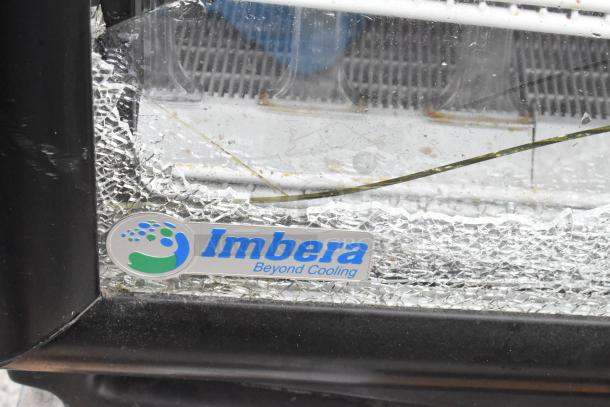 Imbera VR10 metal commercial cooler with glass damage, poly-coated racks, 115V, 1-phase; "Imbera Beyond Cooling" label shown.