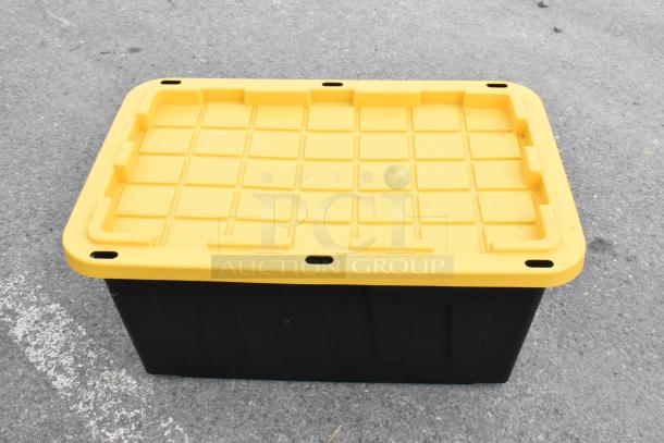 Five black 27-gallon poly bins with yellow lids, durable storage solution, excellent condition.