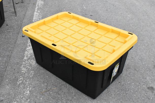 5 black 27-gallon poly bins with yellow lids, shown stacked outdoors. Durable storage solution, new condition.