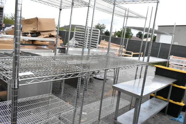 Chrome finish 3-tier wire shelving unit shown outdoors. Requires dismantling. Consider freight charges.