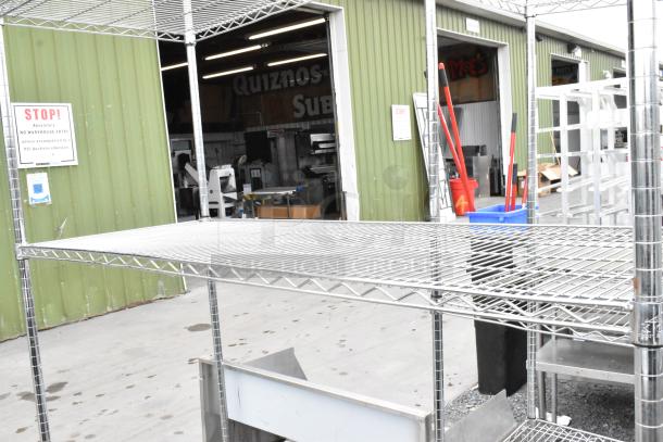 Chrome finish 3-tier wire shelving unit in good condition. Buyer must dismantle; consider freight charges.
