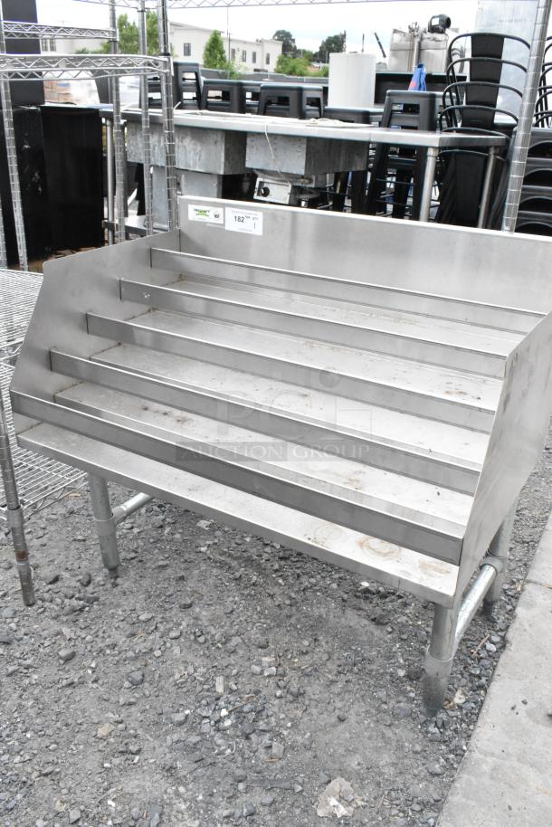 Regency 600LDR2336 stainless steel bottle display rack, multiple tiers, sturdy condition, ideal for retail use.