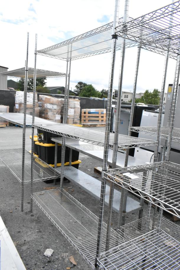 Chrome finish 3-tier wire shelving unit in good condition, outdoor setting. Buyer must dismantle for transport.