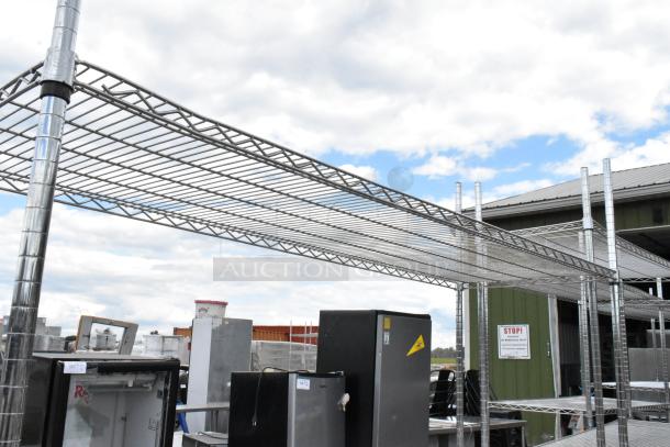 Chrome finish 3-tier wire shelving unit, in good condition, outdoors. Buyer must dismantle and consider freight charges.