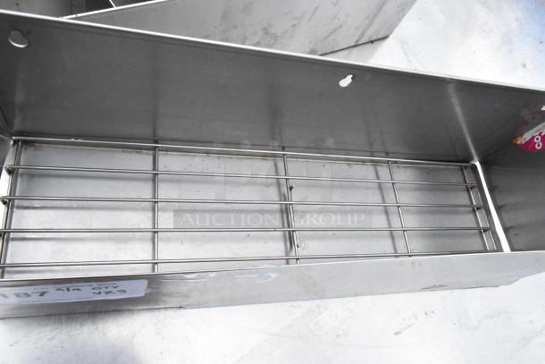 5 stainless steel single speed wells, durable and in good condition, featuring a metal grate at the bottom.