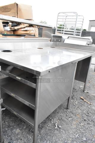 Stainless steel table with side under shelves, featuring a durable, spacious top and stable construction. Ideal for kitchens.