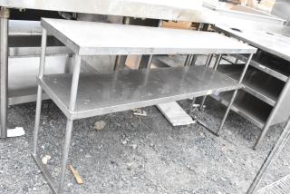 Stainless steel 2-tier over shelf, used condition, featuring durable construction and space-saving design for kitchen organization.