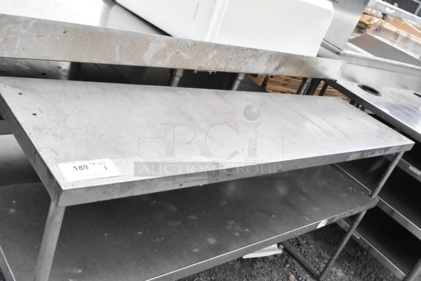 Stainless steel 2-tier over shelf, used condition, with visible wear and labeling indicating item number 189, quantity 1.