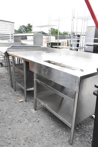 Stainless steel commercial soda station with under shelves, featuring a durable design. Suitable for professional use.