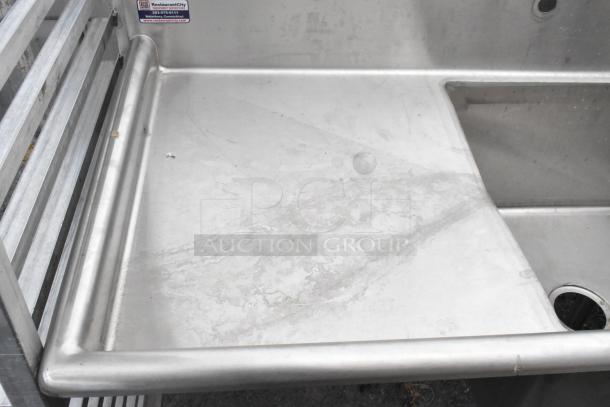 Yukon stainless steel single bay sink with left side drain board; commercial-grade, durable condition, includes visible manufacturer tag.