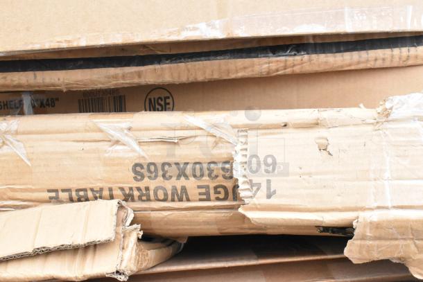Boxes of new scratch and dent items including Regency 24" x 72" NSF wire shelf and Steelton 24" x 60" chrome shelf kit.
