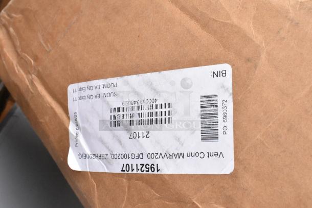 Cardboard packaging with a label featuring barcodes and printed text, part of a scratch and dent auction item.