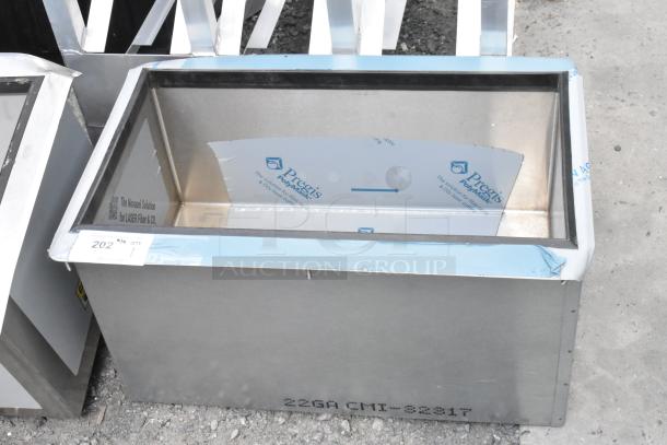 Stainless steel commercial drop-in ice bin, new condition. Markings include "22GA CMI-82817" and branding from "Pregis Polymask."