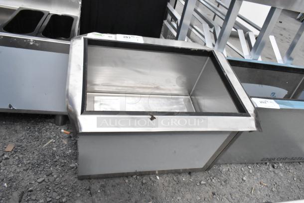 BRAND NEW Regency 600IB2418CP stainless steel drop-in ice bin with cold plate; slight scratches and dents visible.