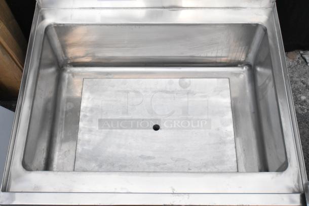 Regency stainless steel ice bin with cold plate, model 600IB2124C7. Brand new scratch and dent. No legs included.