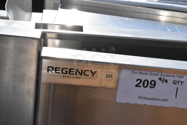 BRAND NEW Regency Spec Line stainless steel bottle rack merchandiser, scratch and dent condition. NSF certified label visible.