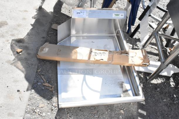 Brand new Regency 600CDT24R clean dish table with right drainboard, 16-gauge stainless steel, minor packaging wear visible.