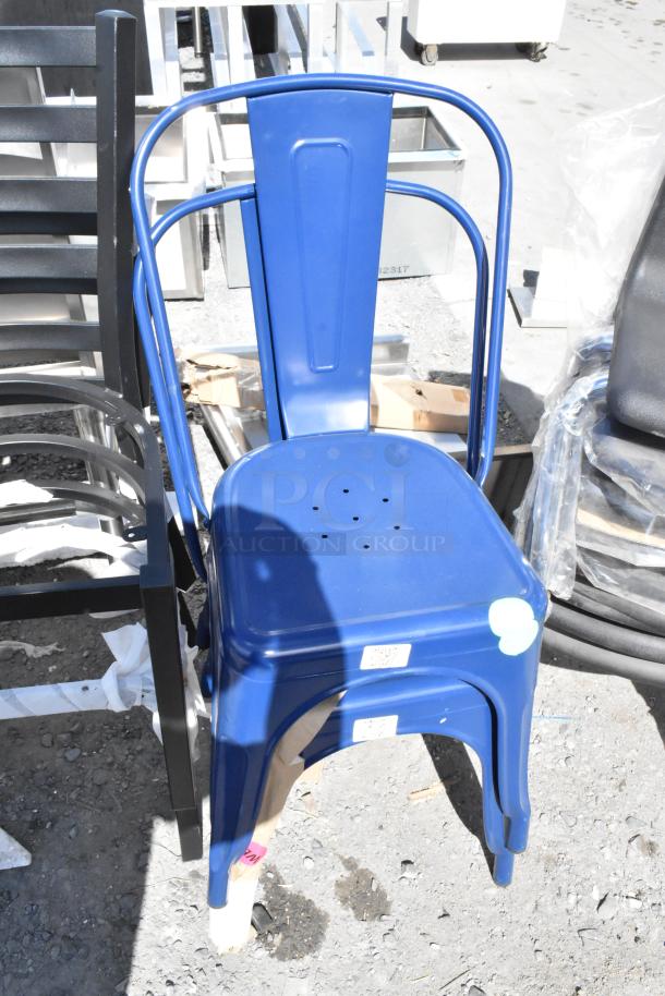 Blue Tolix style metal chair, new, slight scratches, stackable design, alongside black metal chair. Auction lot of 14 items.