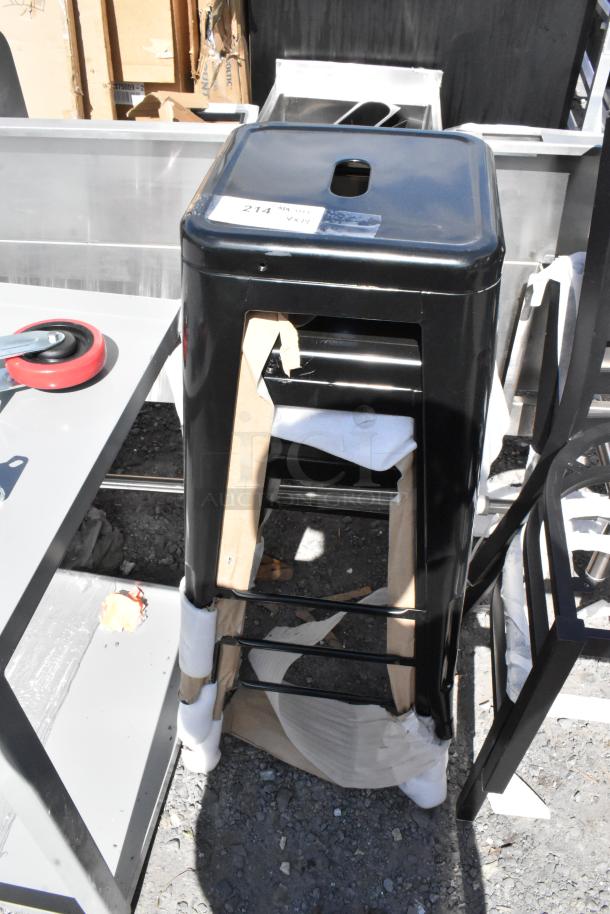 14 scratch and dent items including black metal stools, packaged and stacked. New condition, includes tag labeled "214".
