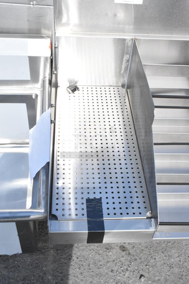 Brand new Regency 600CSLD2972S 72" stainless steel cocktail station with liquor display rack and drainboard, minor scratches.