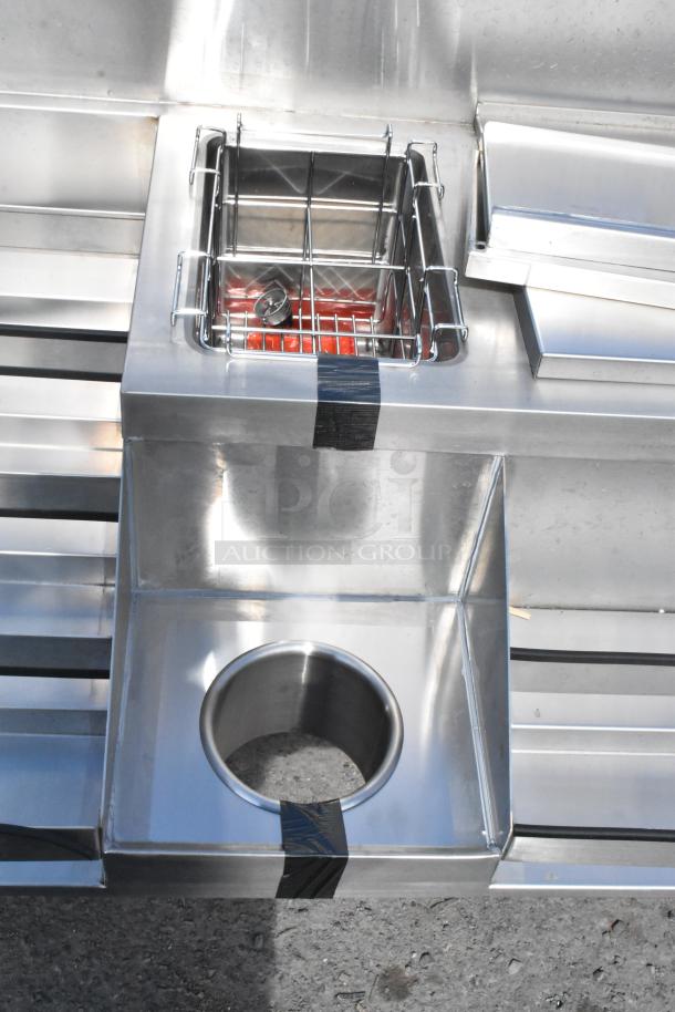 Brand new Regency 600CSLD2972S stainless steel cocktail station with liquor display rack, drainboard; minor scratches.