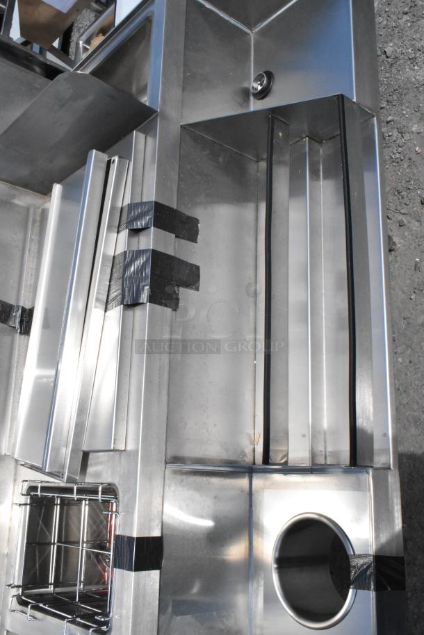 Brand new Regency 600CSLD2972S stainless steel cocktail station with liquor display and drainboard. Minor scratches visible.