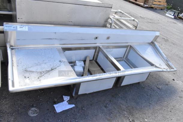 BRAND NEW Regency 600S22323224 stainless steel 2 bay sink with dual drain boards; scratch and dent condition.