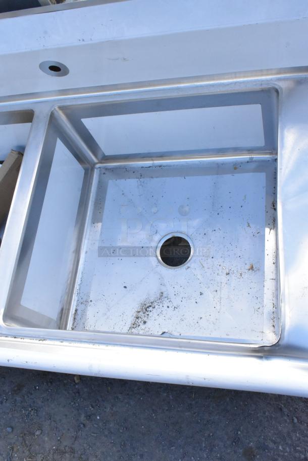 Regency 600S22323224 stainless steel 2 bay sink with dual drain boards, brand new scratch and dent condition.