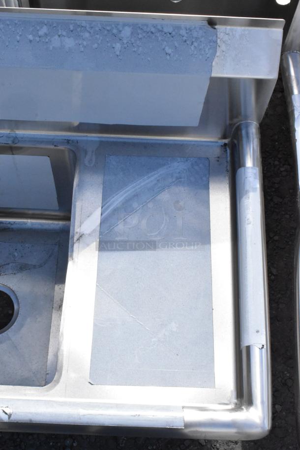 Regency 600S31416212 stainless steel 3-bay sink with dual drain boards, scratch and dent, no legs, brand new.