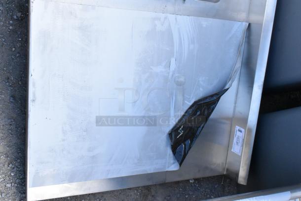 BRAND NEW SCRATCH AND DENT Regency 600ST3048L stainless steel table with single bay sink basin, no legs, slight scratches.