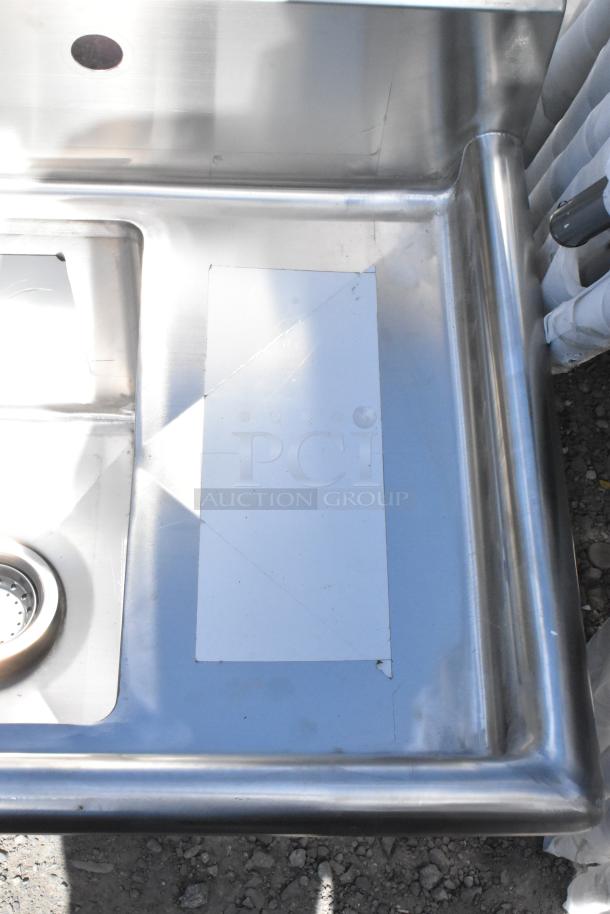 Brand new KoolMore SA101410-10R3 stainless steel sink, 23 in., one compartment, with drainboard. Scratch and dent noted.