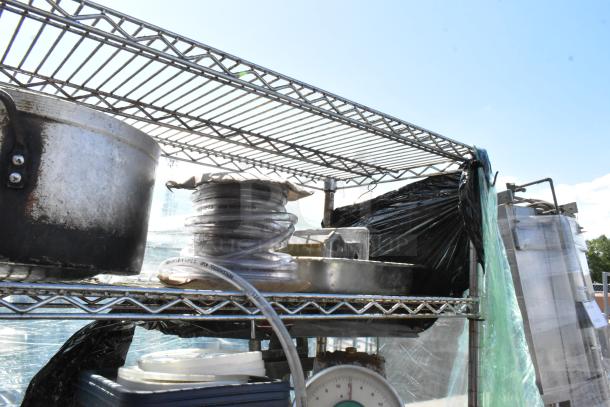 Chrome 5-tier wire shelving unit with poly bins, stock pot, Pelouze scale, China cap strainer, lids. Used condition.
