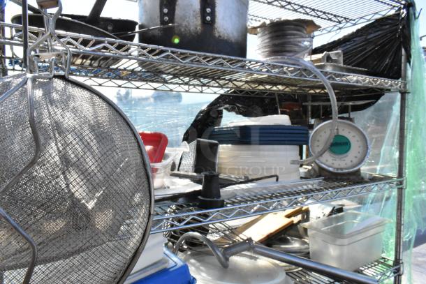 Chrome 5-tier wire shelving unit with poly bins, stock pot, Pelouze scale, China cap strainer, and lids. Buyer must dismantle.