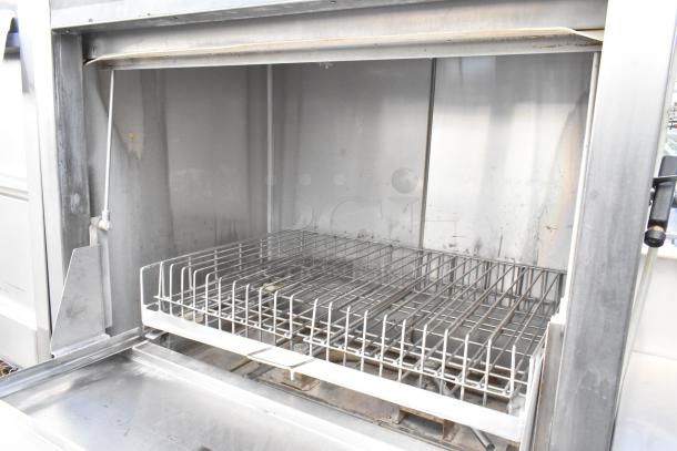 Douglas SD-20-E-480/3 stainless steel commercial front-load pot and pan washer. 480 volts, 3 phase. Interior view.