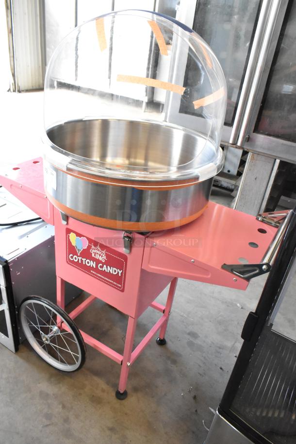 Brand new Carnival King 382CCM21CT commercial cotton candy machine. Includes 21" stainless bowl, floss bubble, pink cart. 120V.
