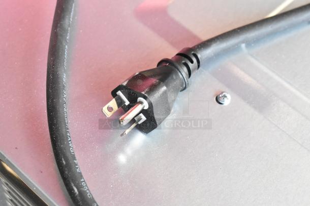 Close-up of the power plug for the KoolMore KM-CWO24-SS. Scratch and dent, new condition. 120 Volts, 1 Phase.