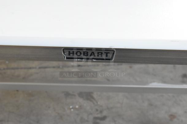 Hobart HRT5 stainless steel commercial roller conveyor wrapping station, features robust construction, visible Hobart logo.