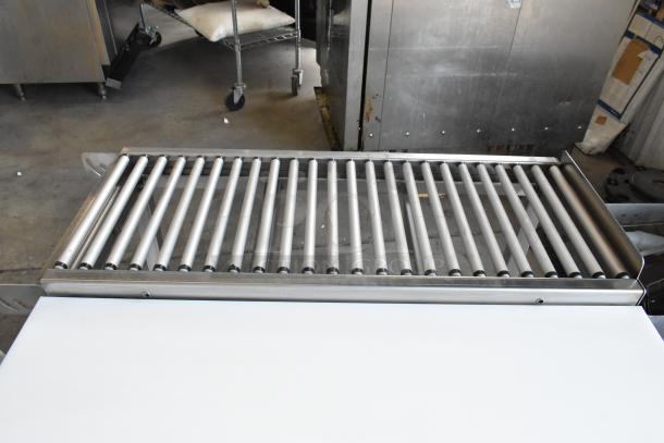 Hobart HRT5 stainless steel roller conveyor wrapping station, excellent condition, ideal for commercial use.