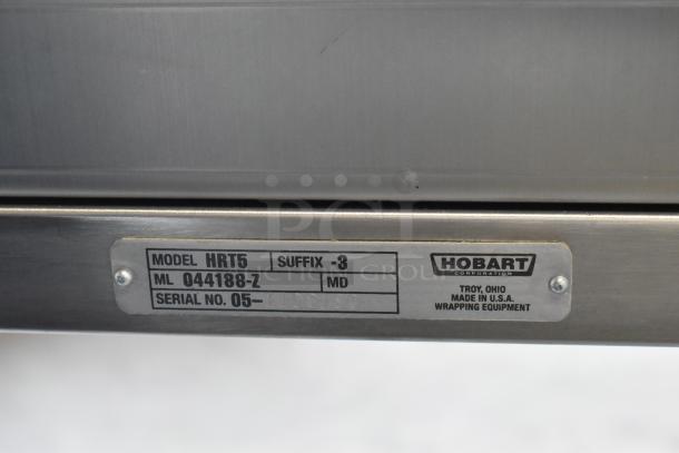 Hobart HRT5 stainless steel commercial rolling conveyor wrapping station, model HRT5, serial 05, made in USA.